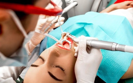 patient being treated by our skilled dentist in Burleson after getting IV sedation